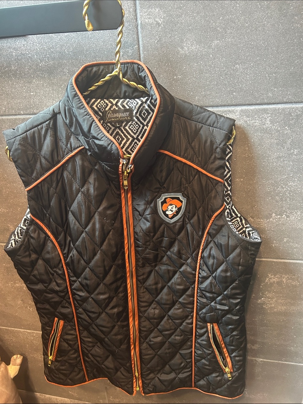 Ladies Black Quilted Vest with OSU Orange Trim and Pistol Pete Appliqué